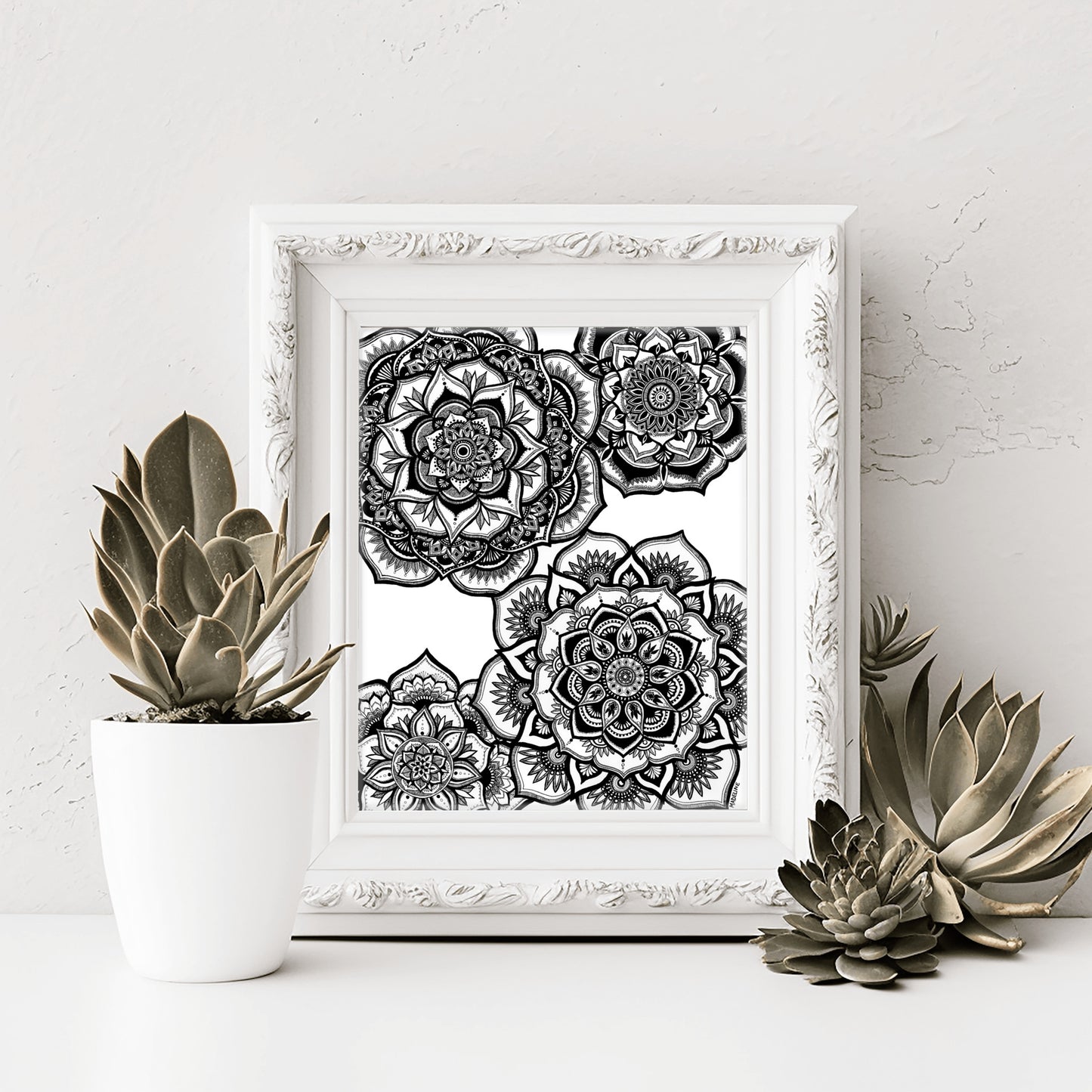 A fine art giclée print featuring four detailed black and white floral mandalas
