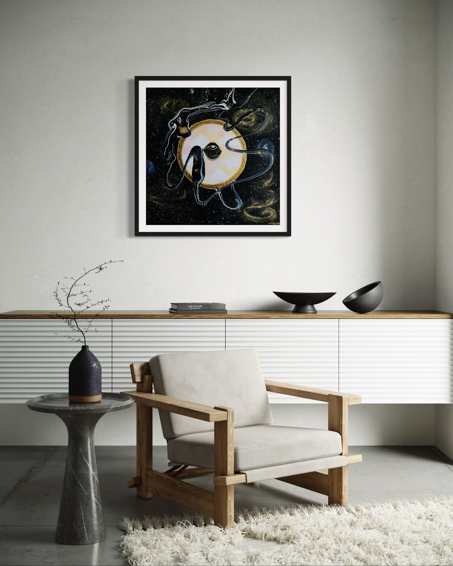 Framed black and gold artwork of a celestial night space scene with a planet and eye against a starry background.