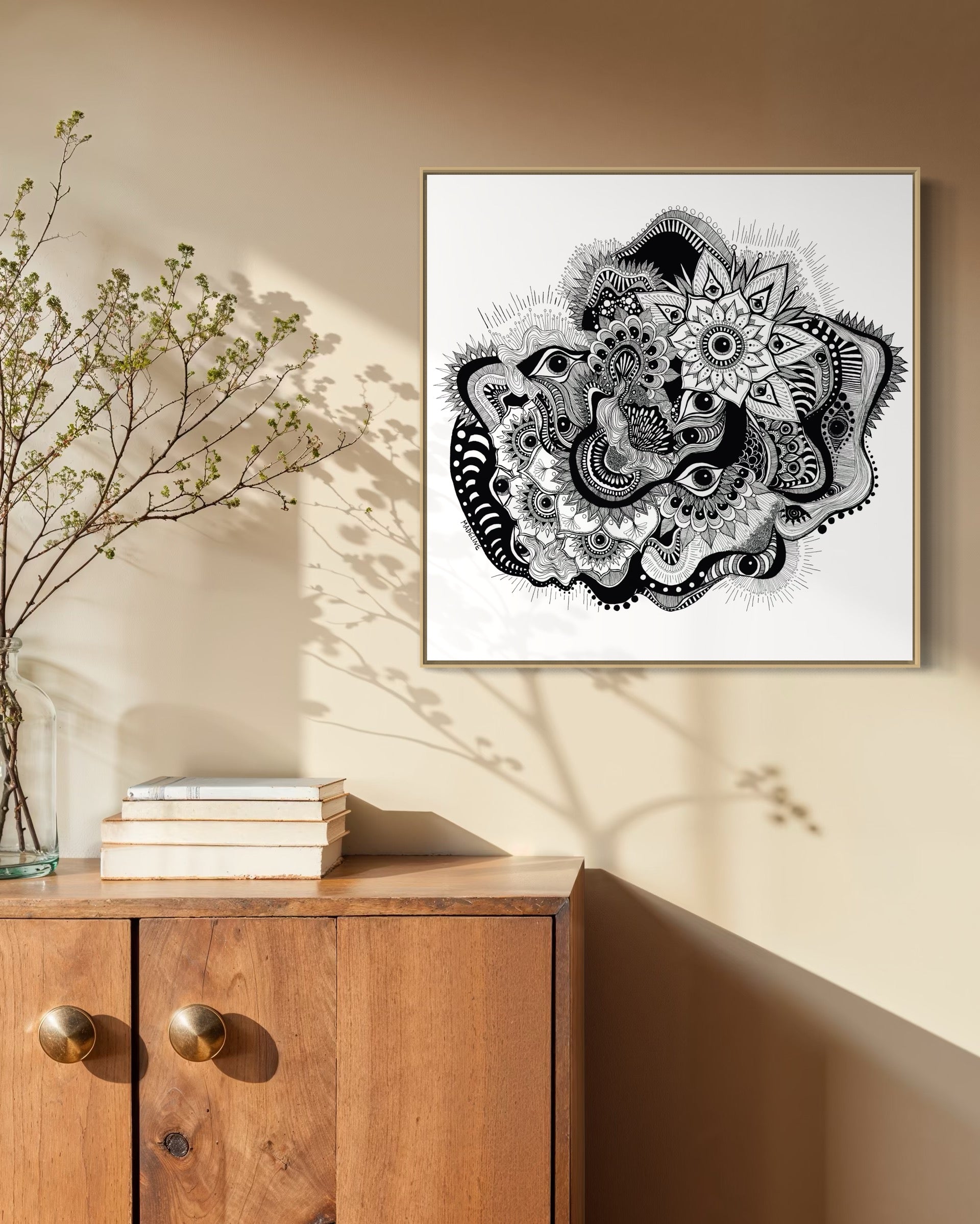 Framed black and white abstract art with eyes, mandalas, and fine line whimsical detail