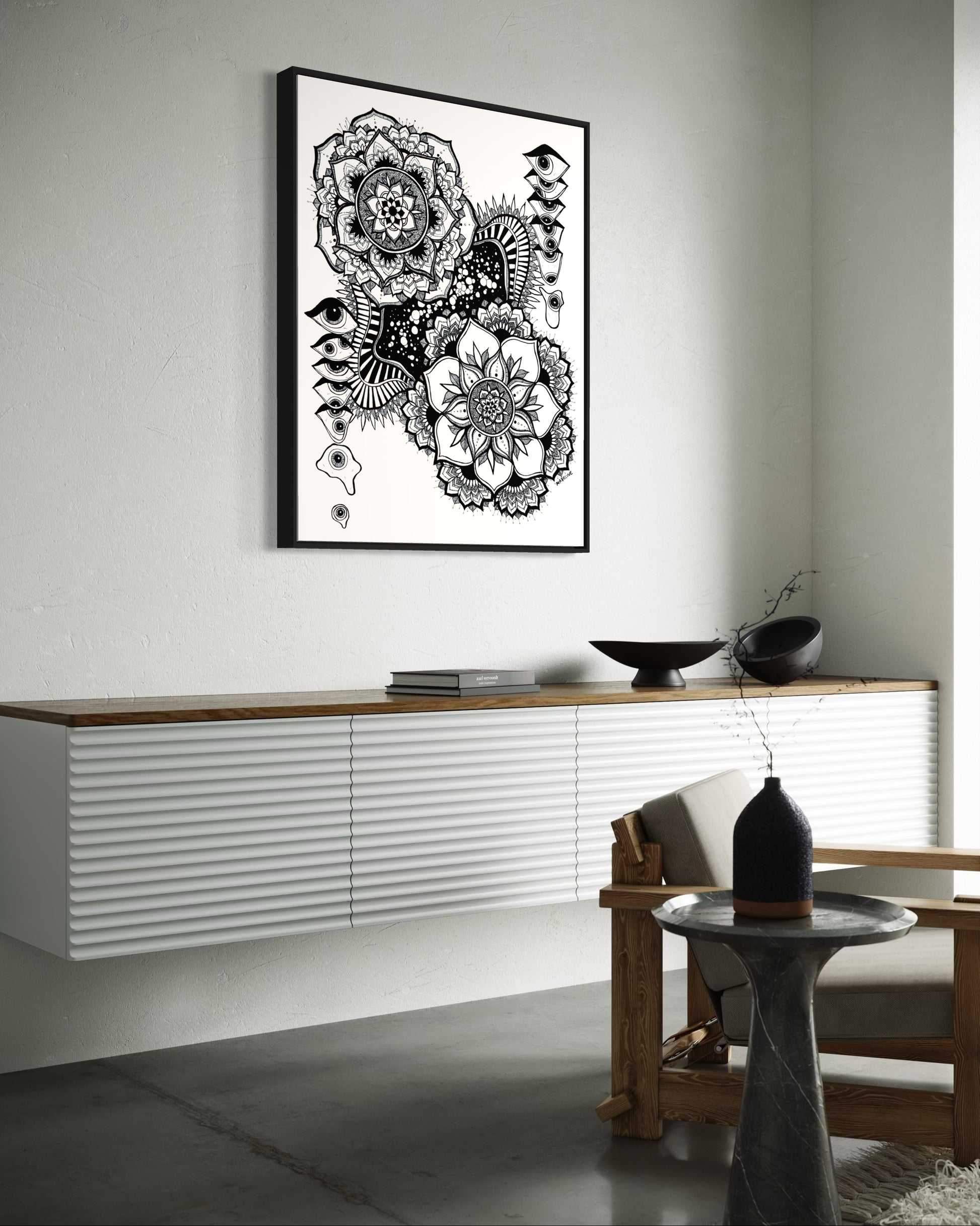 Black and white floral mandala and abstract eye design on a white background