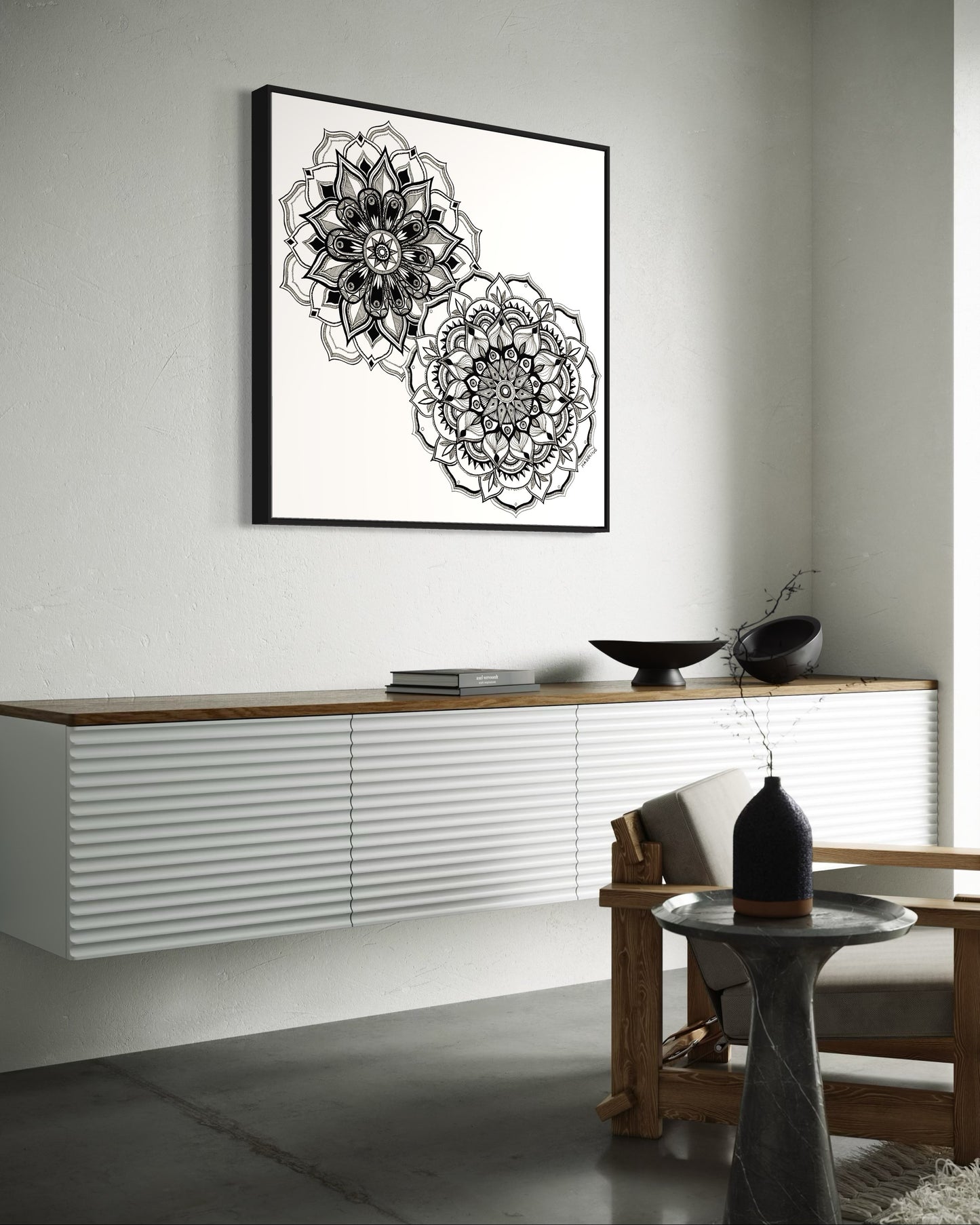 Framed artwork of two black and white mandala flower designs on a white background