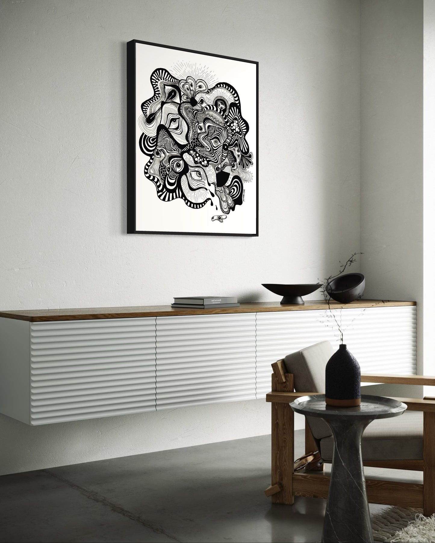 Framed black and white abstract artwork filled with eyes and whimsical linework patterns on a white background
