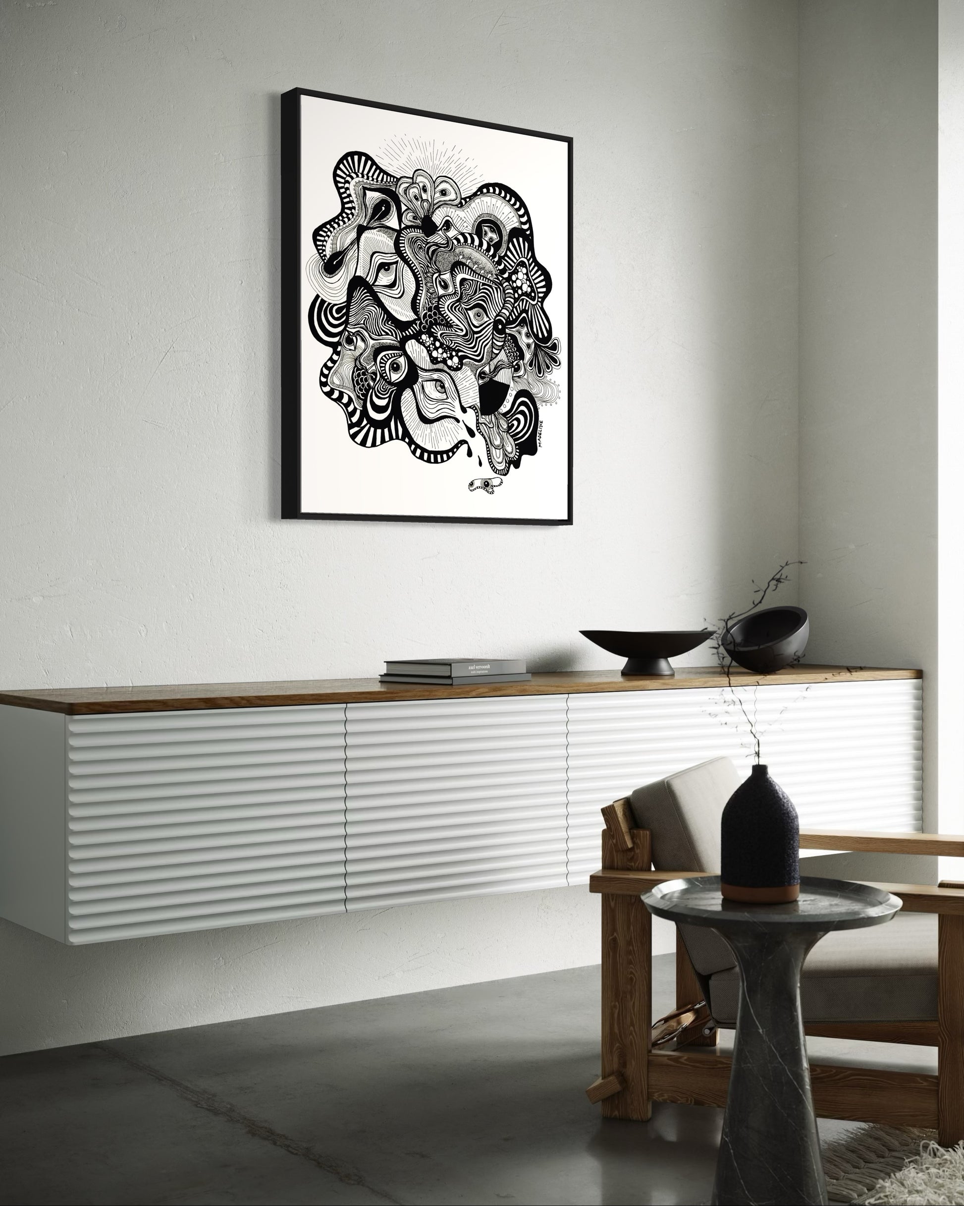 Framed black and white abstract artwork filled with eyes and whimsical linework patterns on a white background