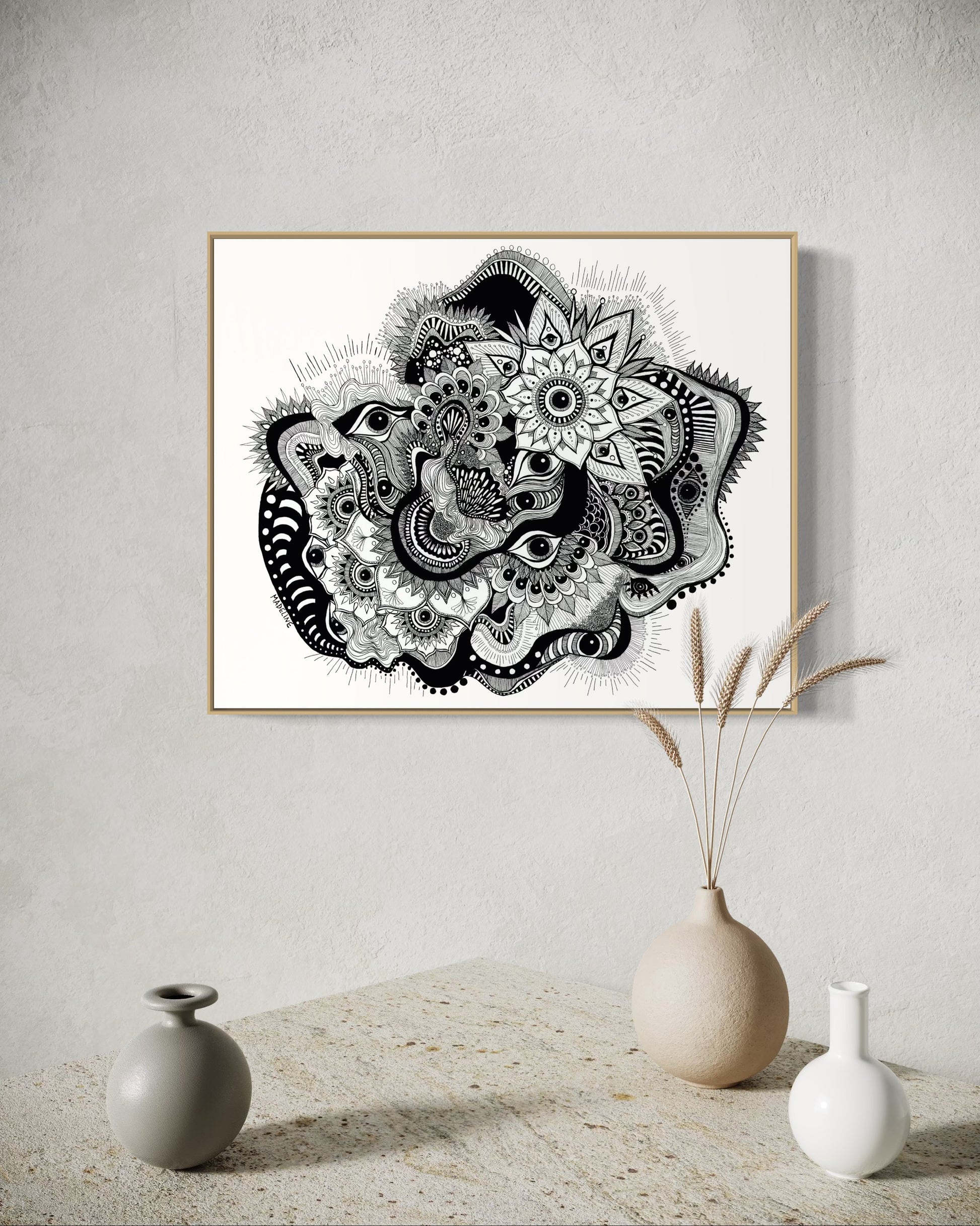 Framed black and white abstract art with eyes, mandalas, and fine line whimsical detail