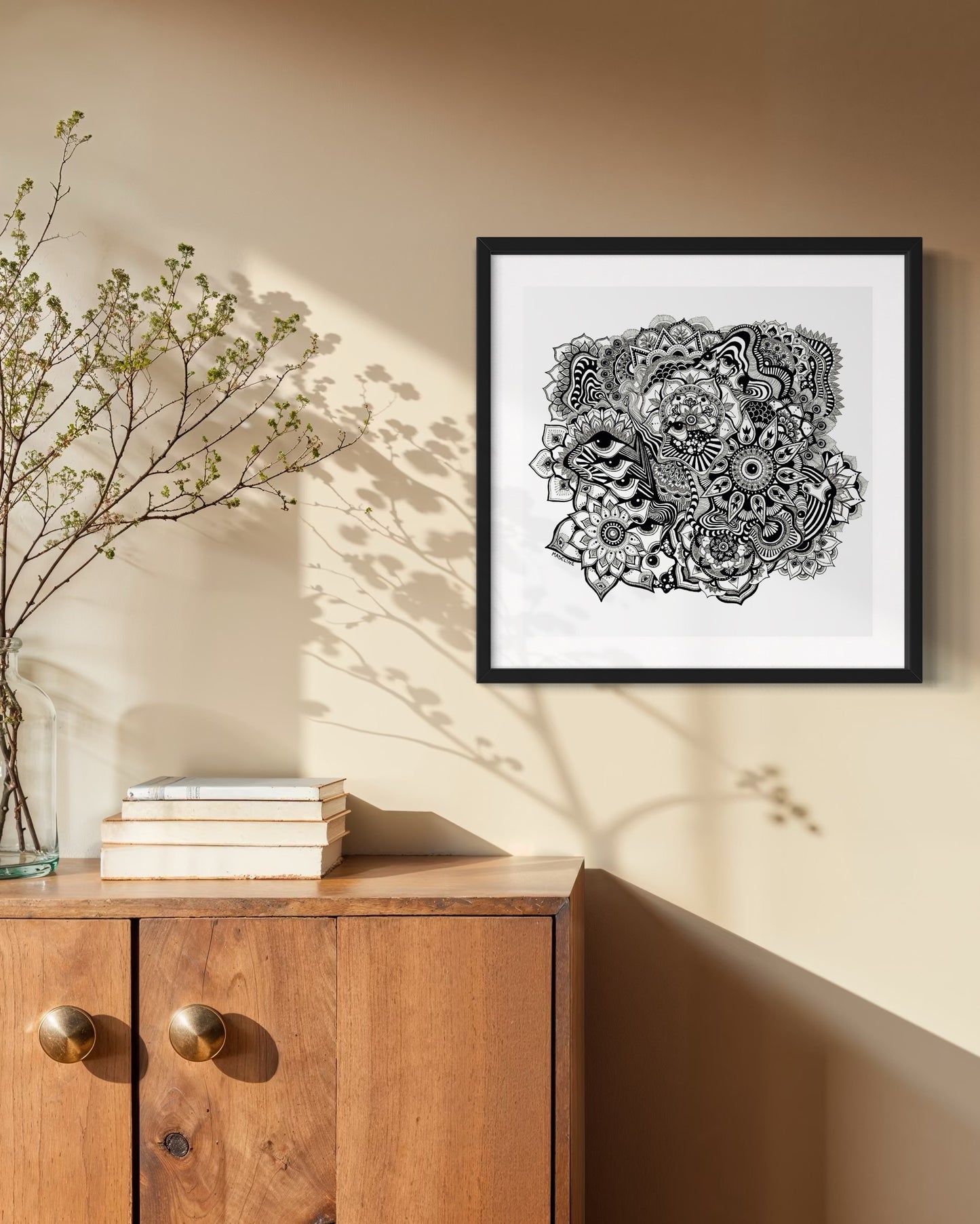 Framed black and white abstract art with eyes, mandalas, and fine line whimsical detail