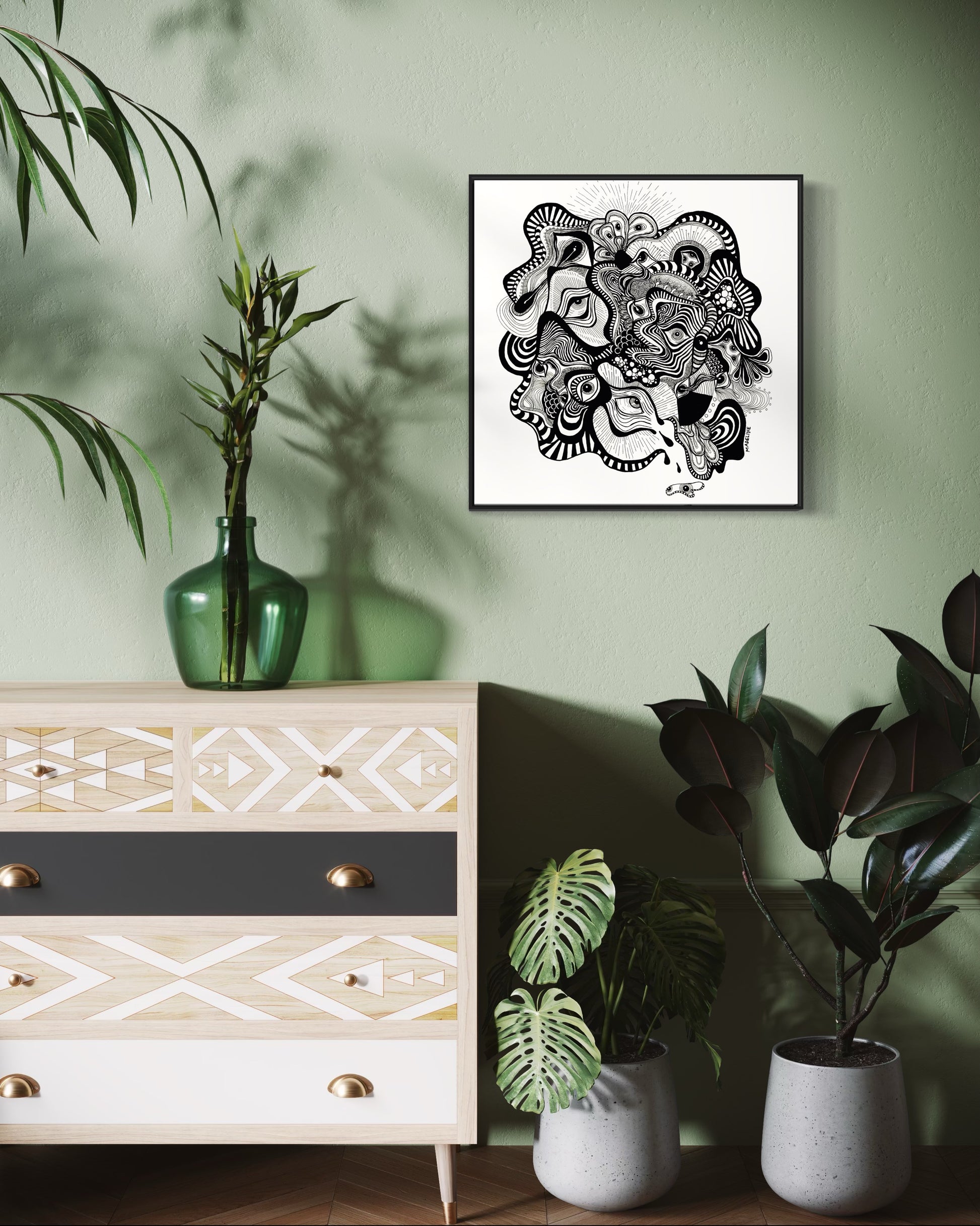 Framed black and white abstract artwork filled with eyes and whimsical linework patterns on a white background