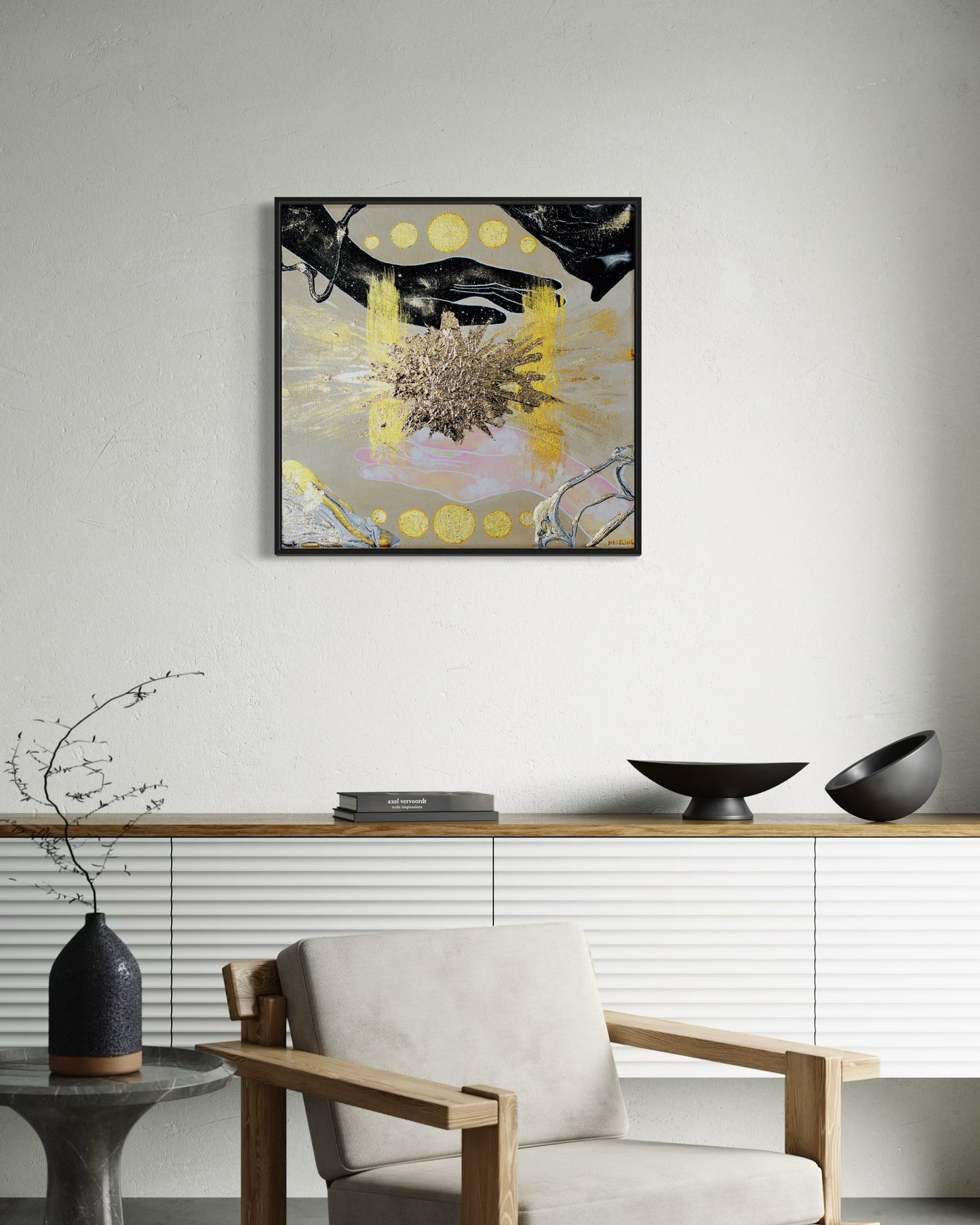 Framed abstract artwork of hands filled with the sky, an exploding gold star and geometric shapes on a tan background.