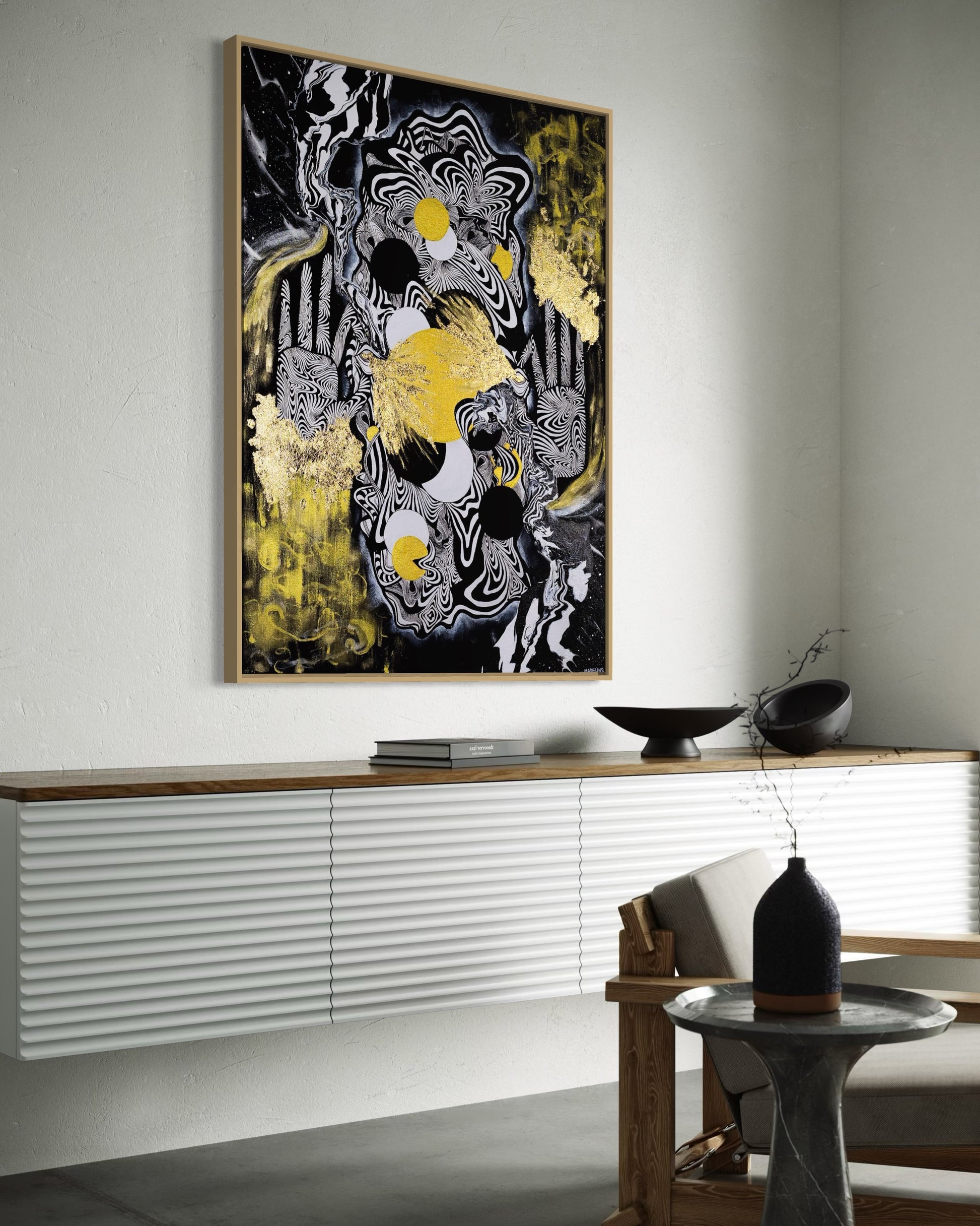 Abstract celestial artwork with black, white, gold and yellow colors with gold leaf, eyes, linework, and abstract hands in a black frame.