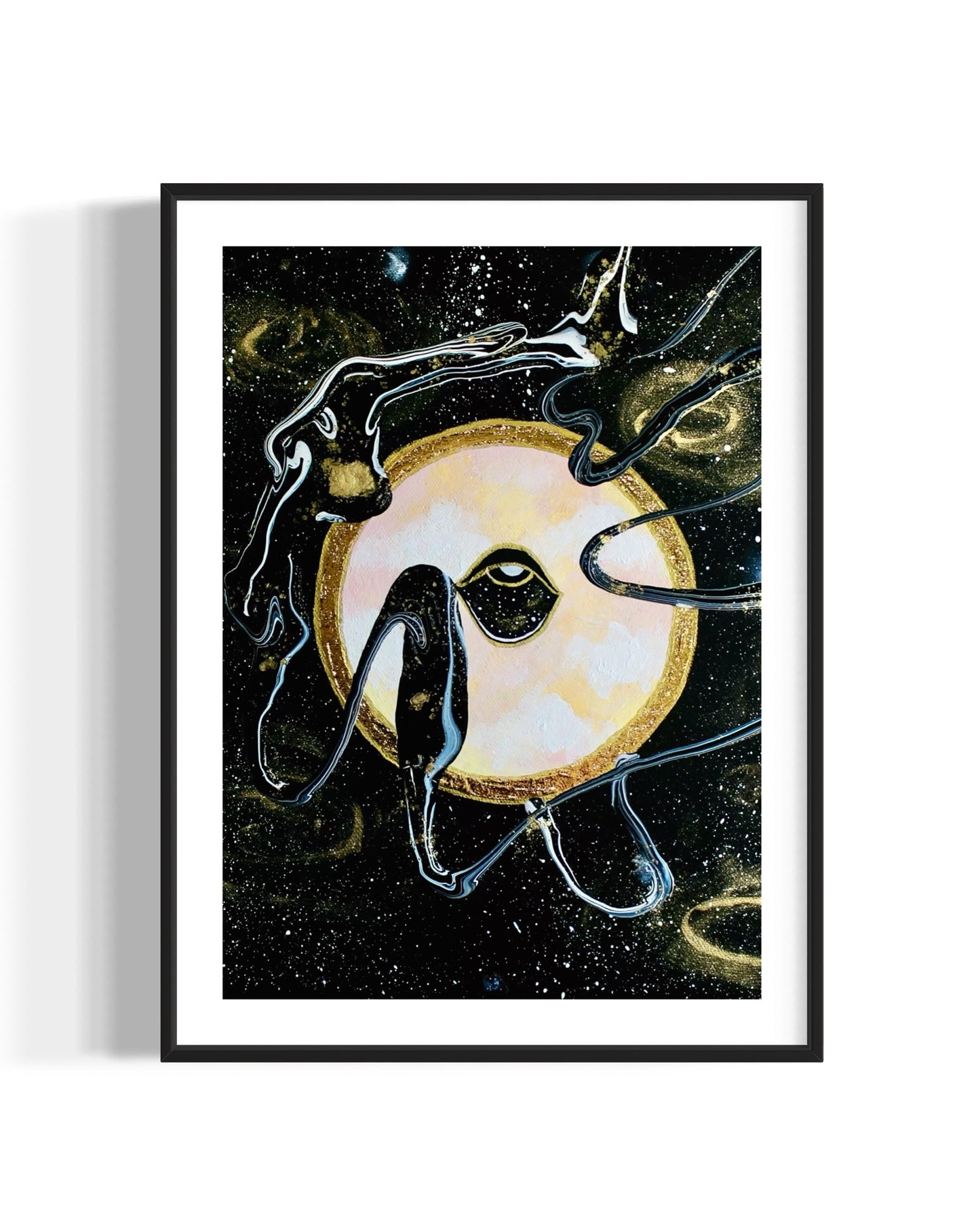 Framed black and gold artwork of a celestial night space scene with a planet and eye against a starry background.