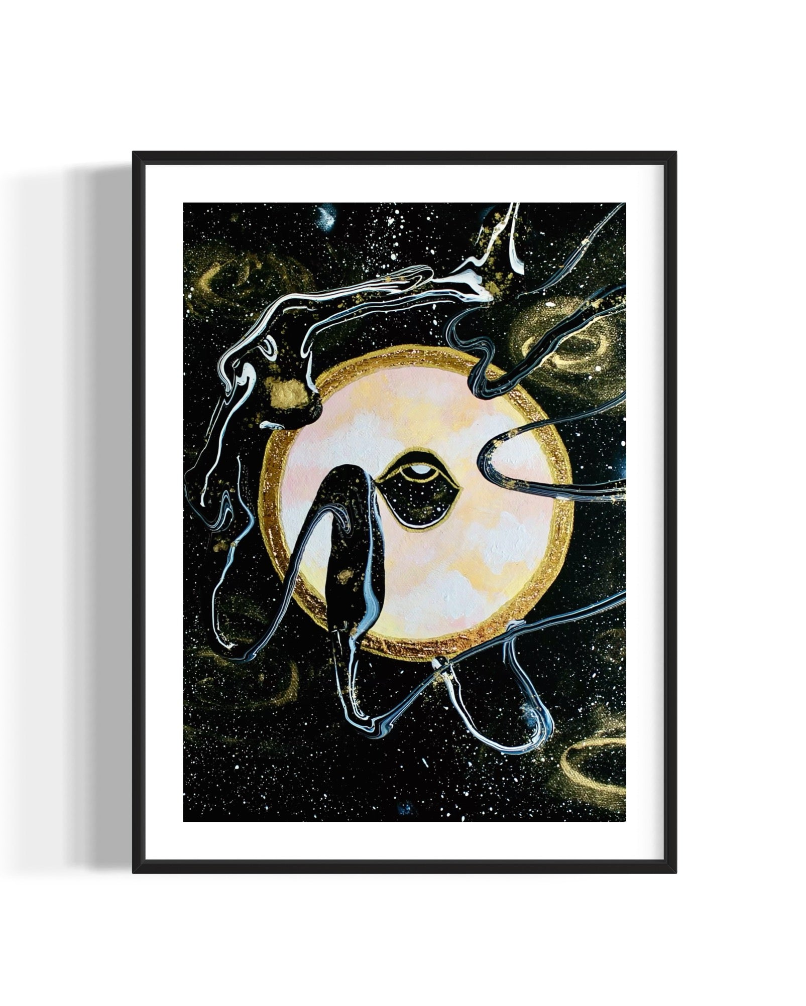 Framed black and gold artwork of a celestial night space scene with a planet and eye against a starry background.