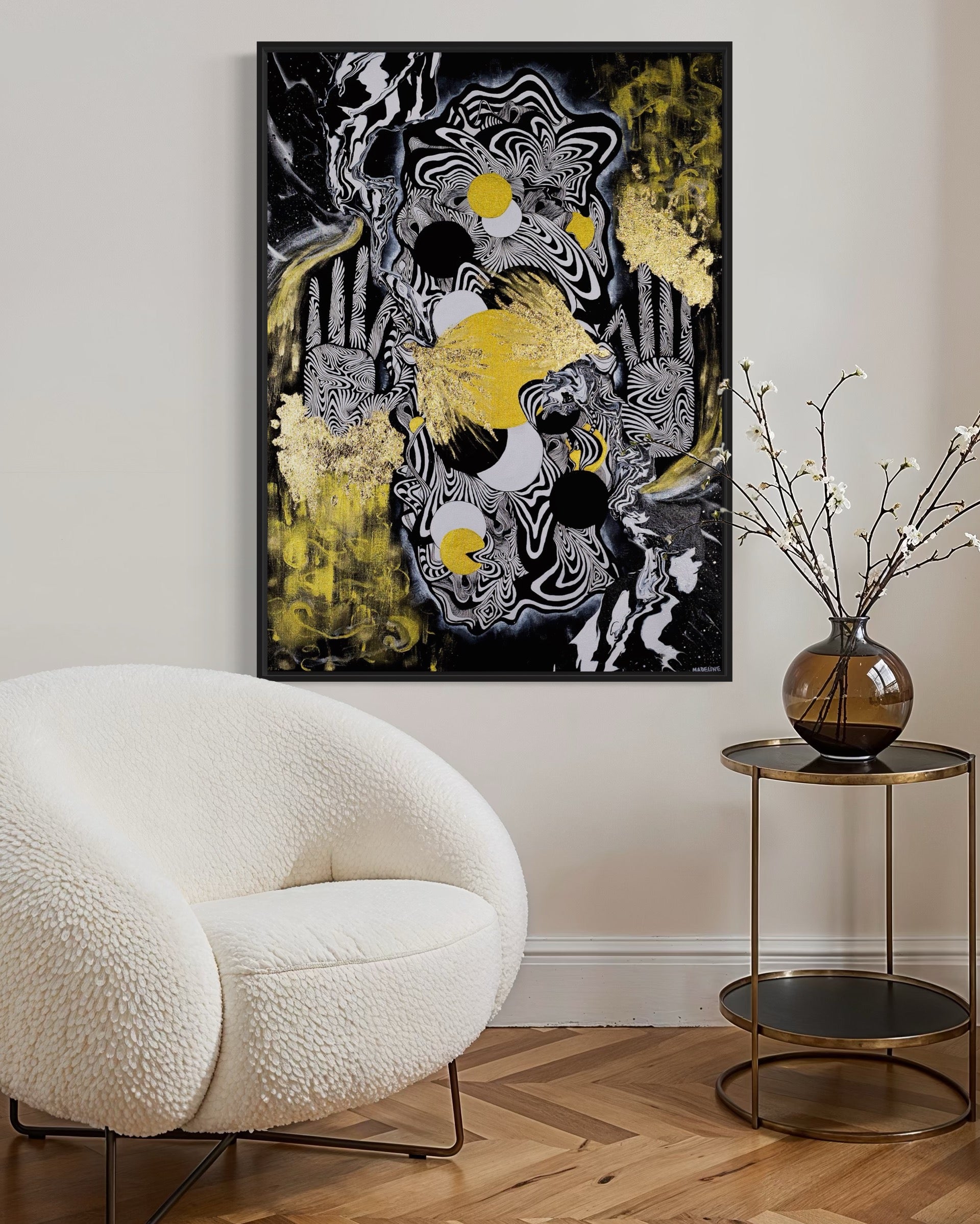 Abstract celestial artwork with black, white, gold and yellow colors with gold leaf, eyes, linework, and abstract hands in a black frame.