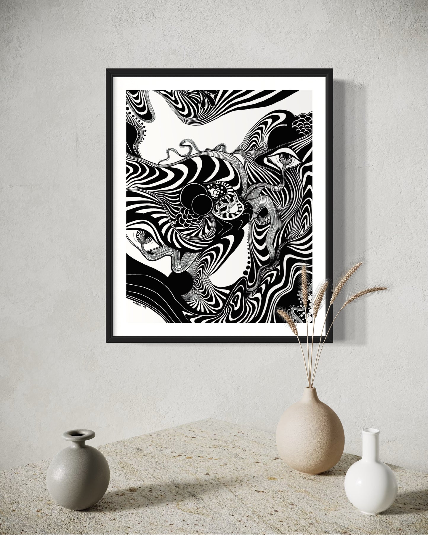 Framed black and white abstract artwork of flowing whimsical linework patterns coming out of eyes