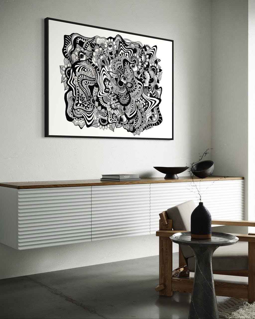 Framed black and white abstract geometric artwork with eyes, whimsical linework and botanicals on a white background