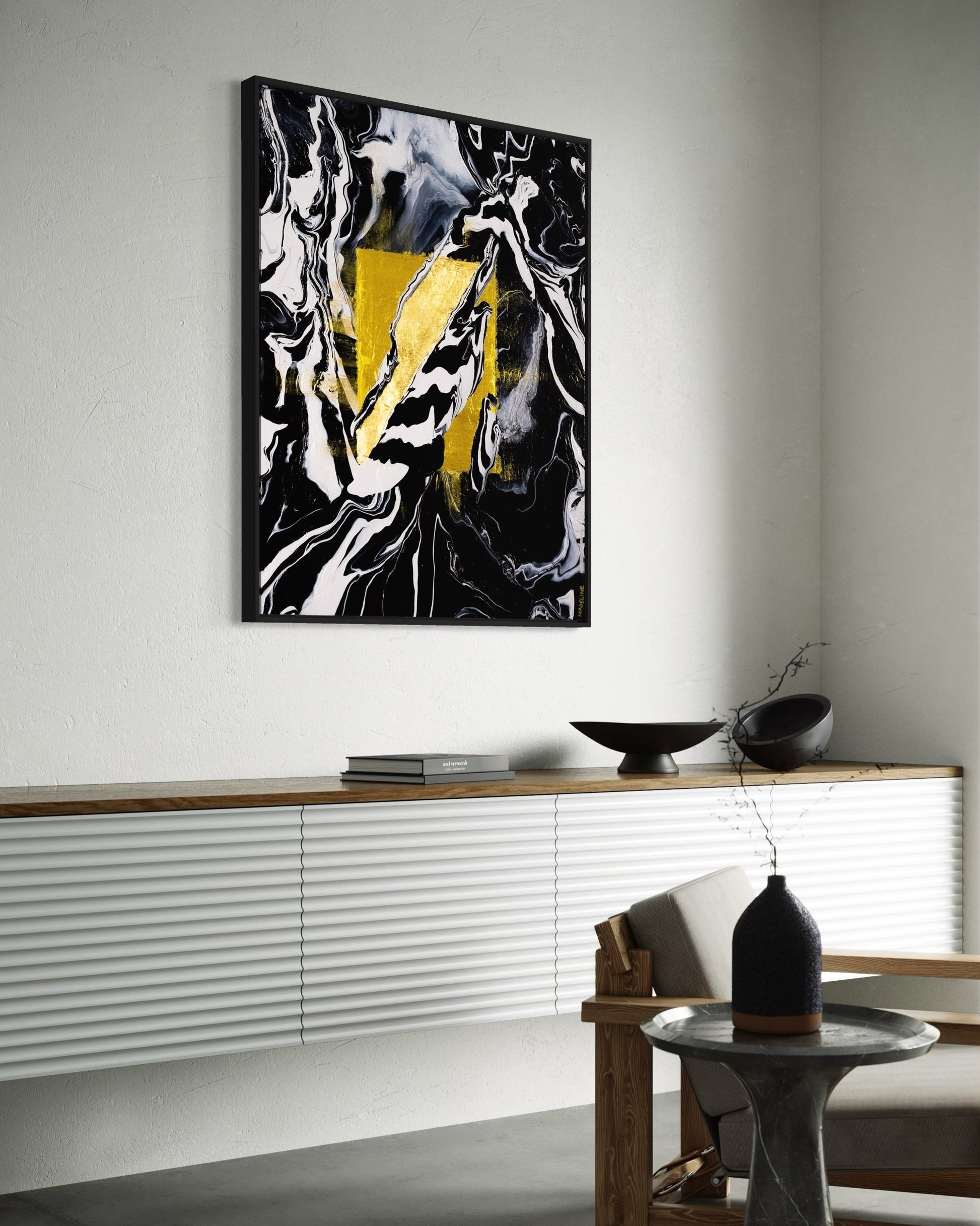 Abstract art piece with gold square and black, white, and gray abstract swirls and shapes