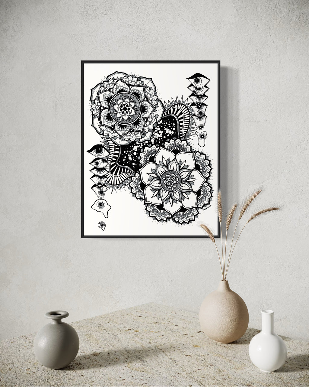 Black and white floral mandala and abstract eye design on a white background