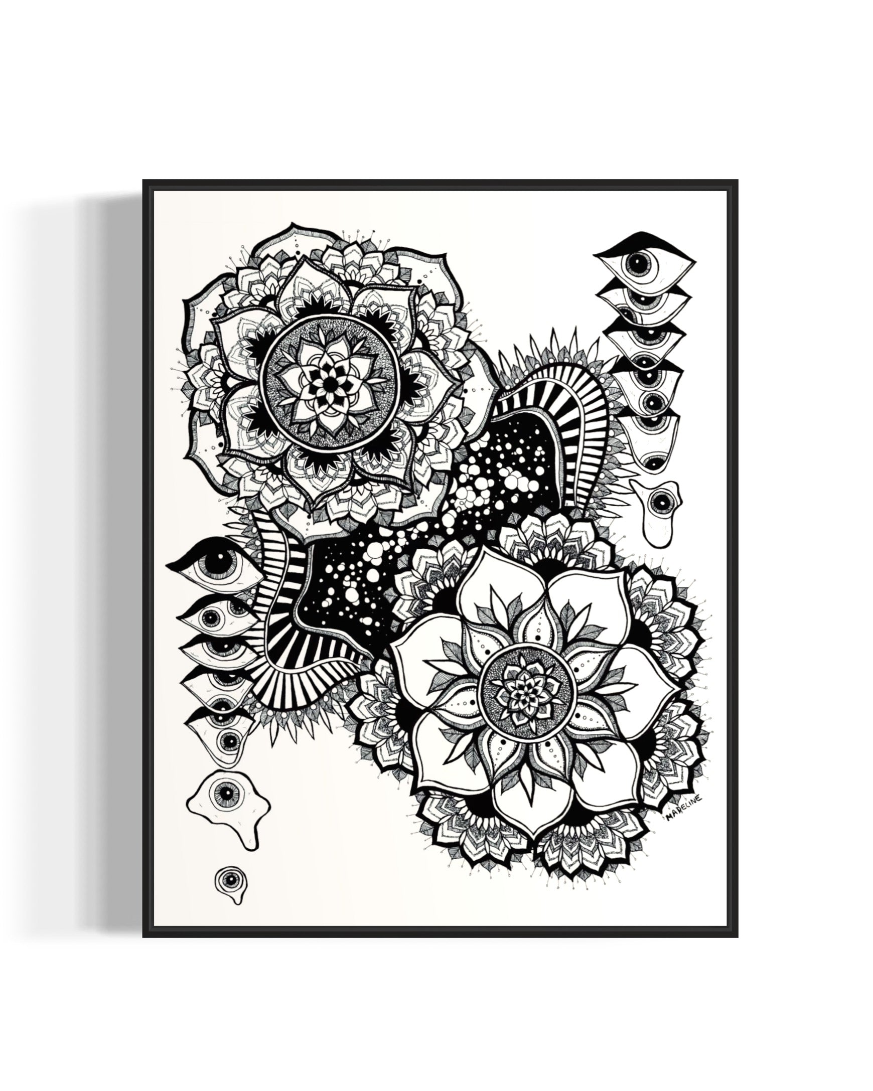 Black and white floral mandala and abstract eye design on a white background