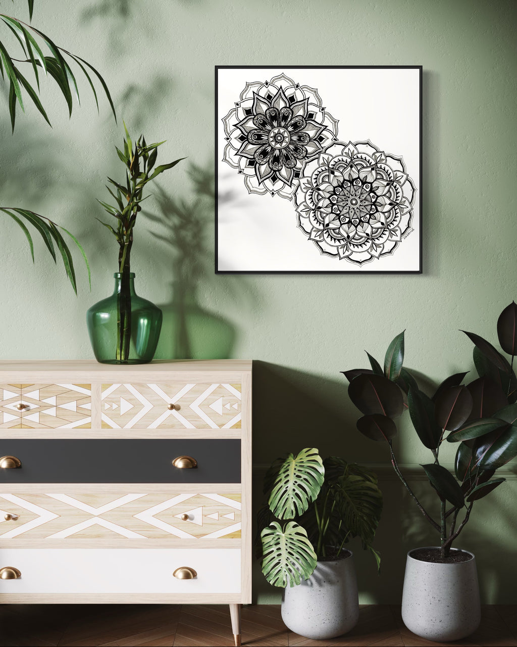 Framed artwork of two black and white mandala flower designs on a white background