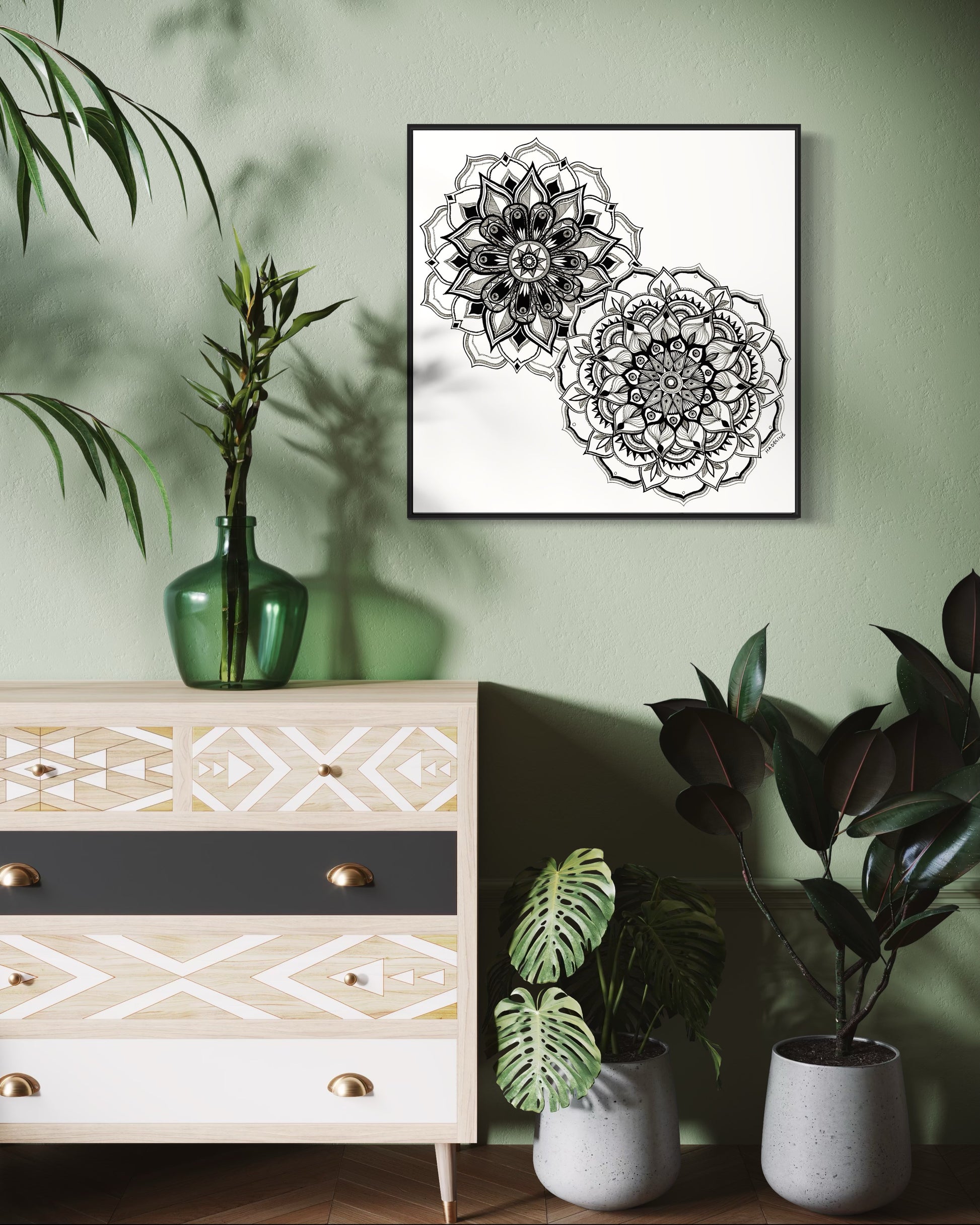 Framed artwork of two black and white mandala flower designs on a white background