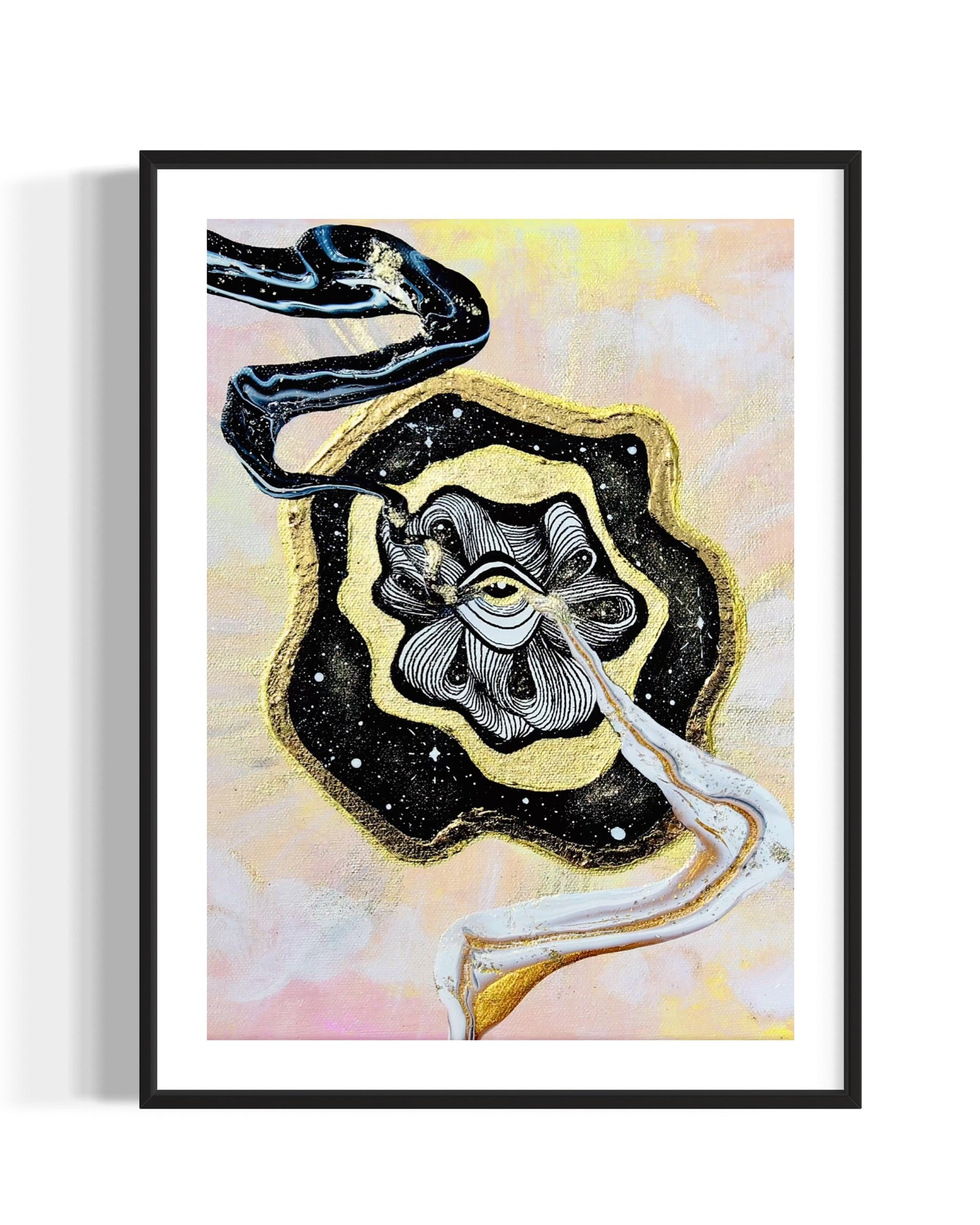 Framed artwork with a black and gold abstract swirls coming out of golden eye on a night sky over a pastel pink and yellow sky background