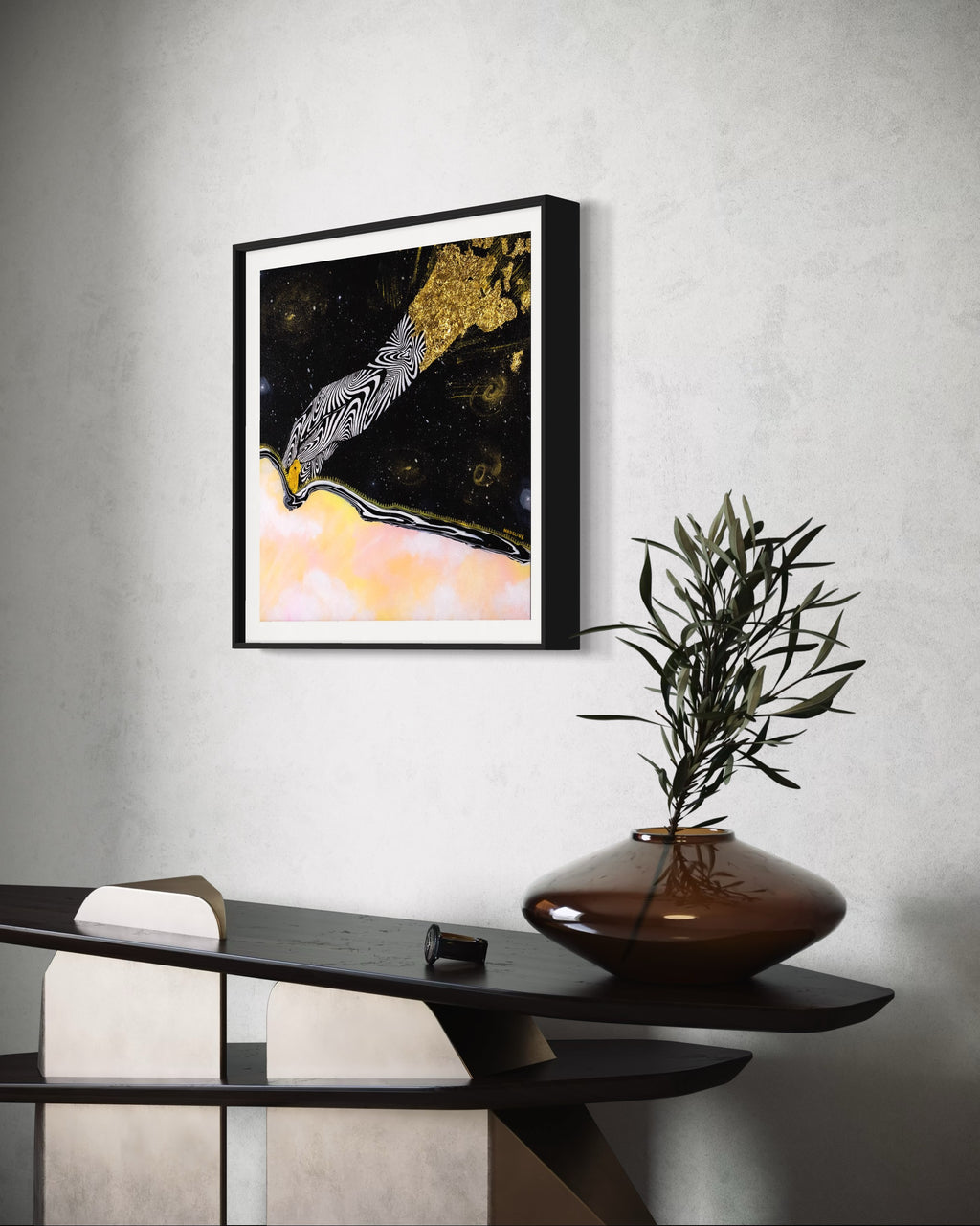 Framed artwork of an abstract black and white hand unzipping the universe on a space background with a pink sky and gold accents.