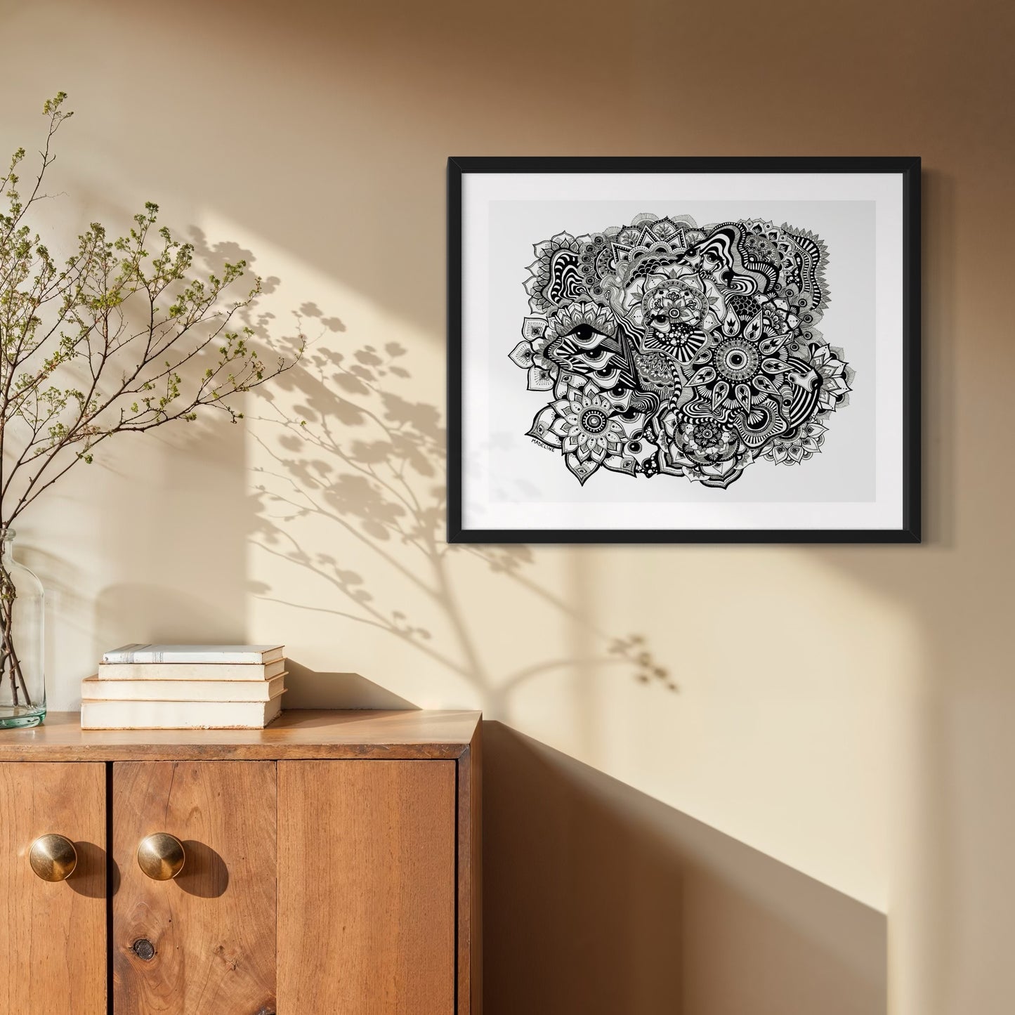 Framed black and white abstract art with eyes, mandalas, and fine line whimsical detail