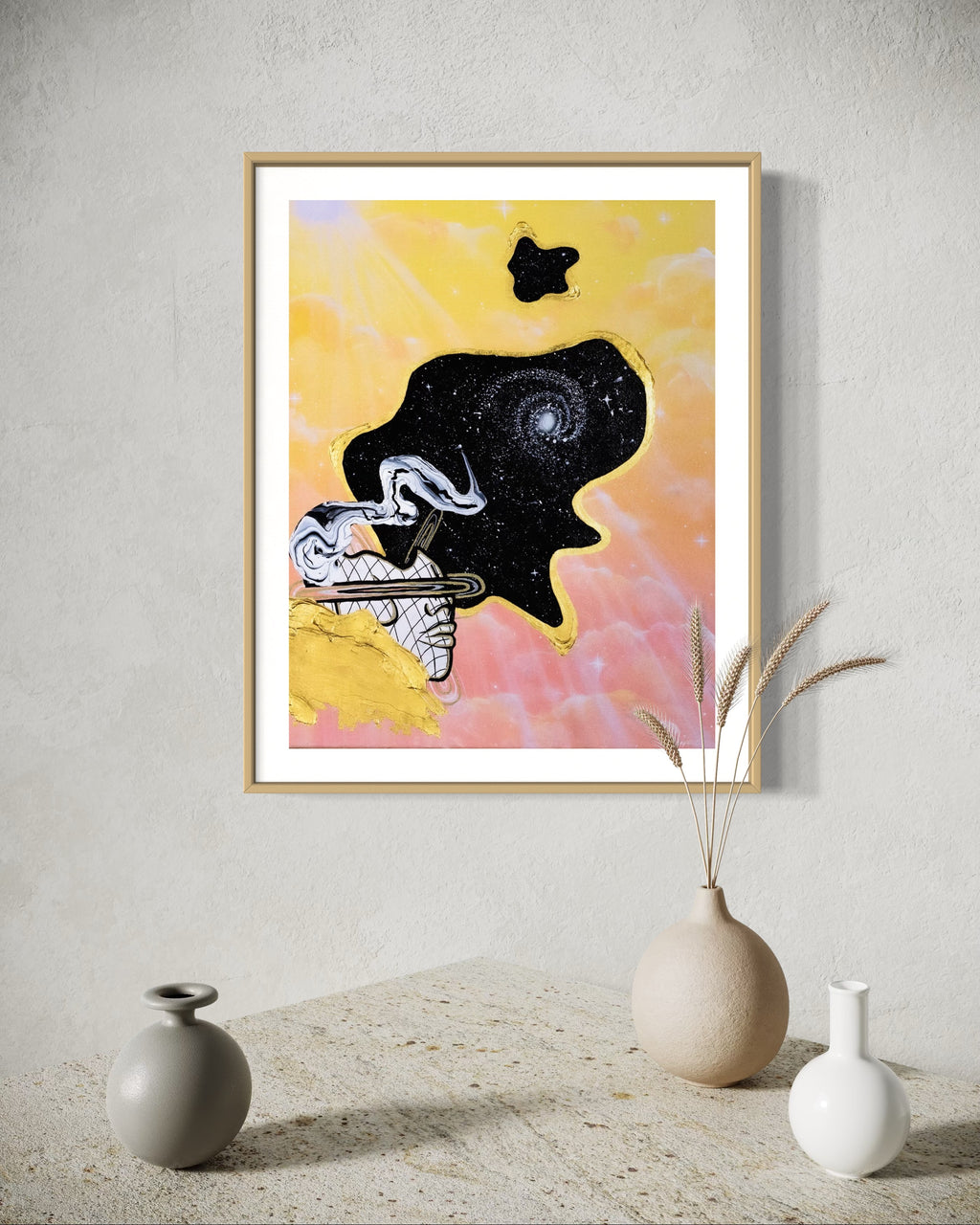 Framed abstract celestial artwork with a black cosmic space bubble, white swirl patterns, a silhouette, and yellow and pink pastel cloud background.
