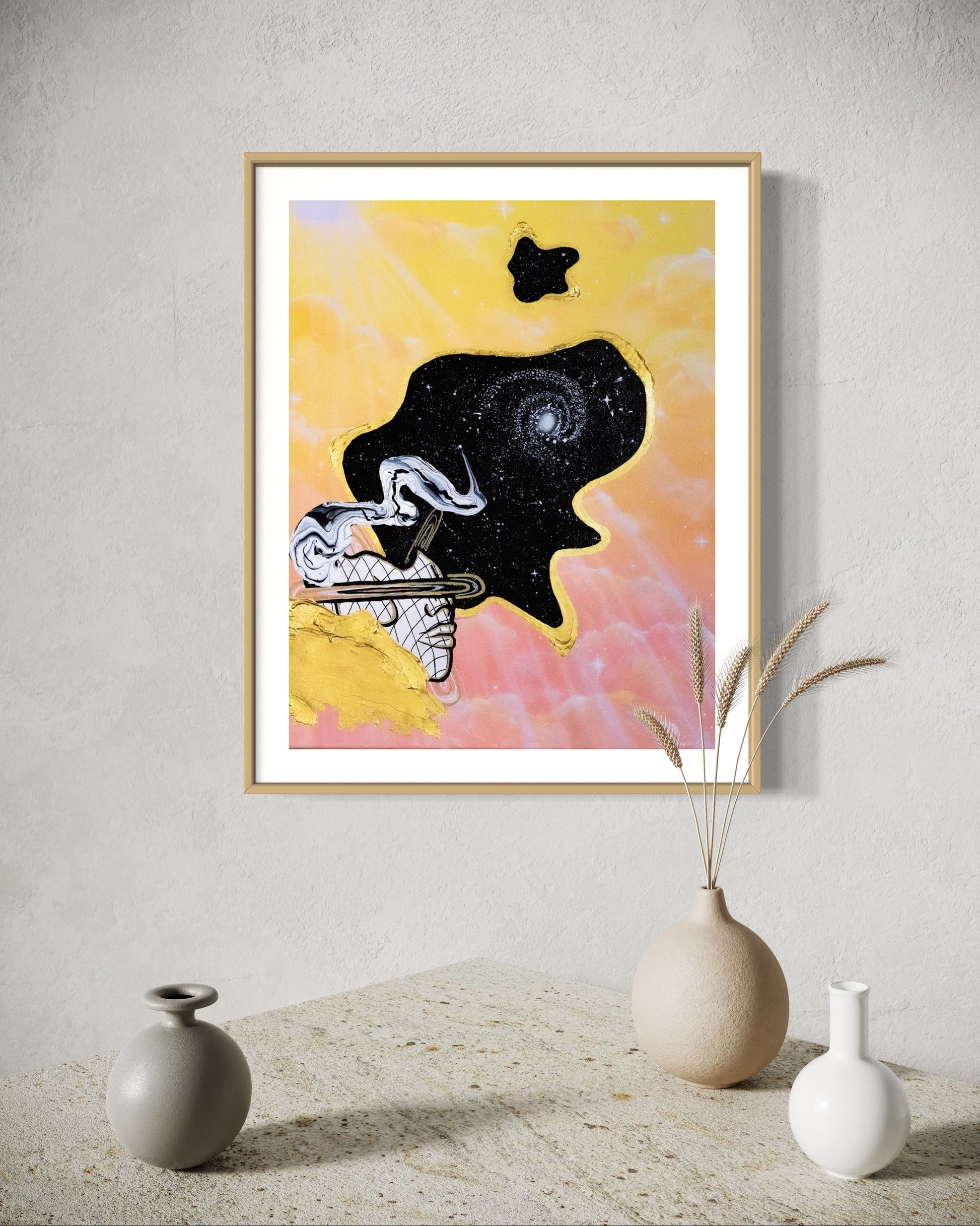 Framed abstract celestial artwork with a black cosmic space bubble, white swirl patterns, a silhouette, and yellow and pink pastel cloud background.
