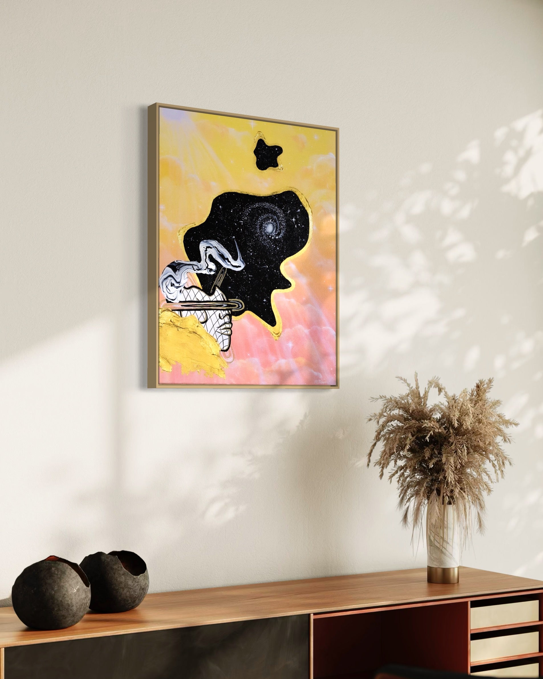 Framed abstract celestial artwork with a black cosmic space bubble, white swirl patterns, a silhouette, and yellow and pink pastel cloud background.