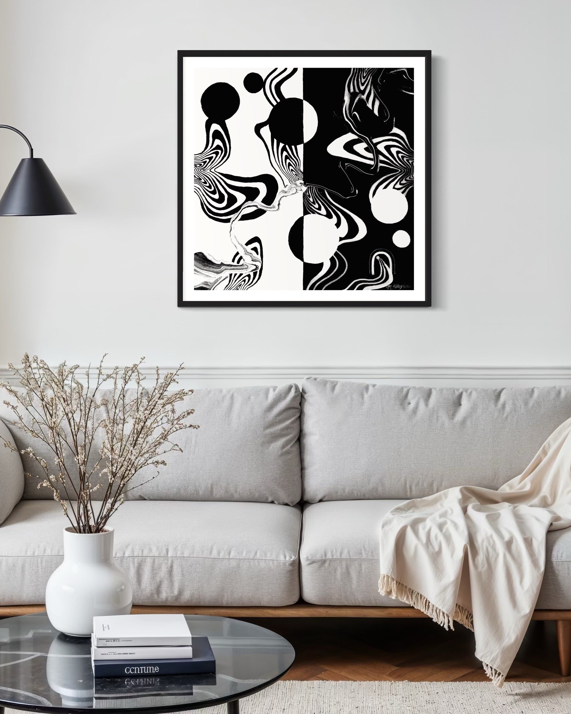 Abstract black and white artwork with swirling patterns, circle, and whimsical linework on a white background