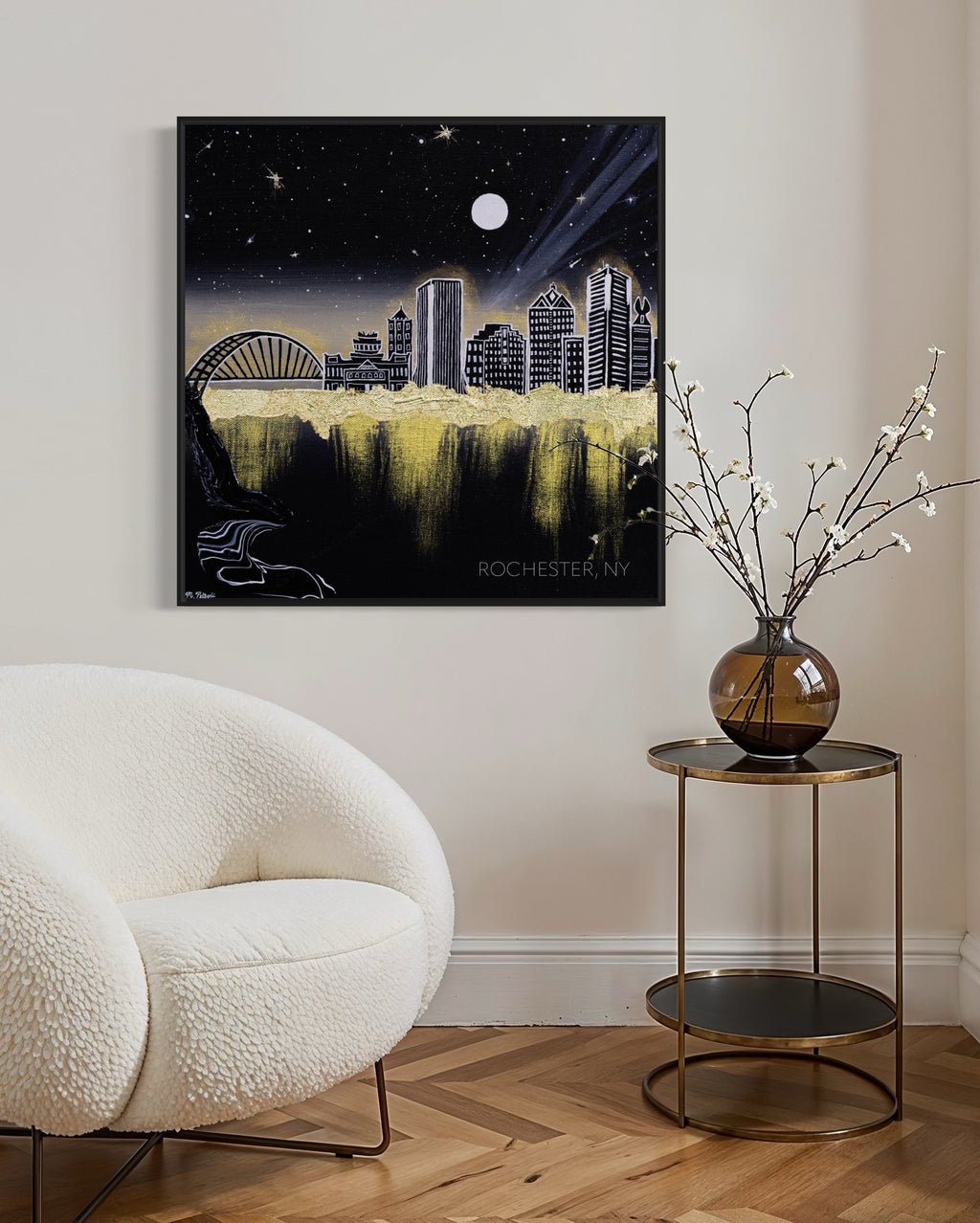 Framed artwork of Rochester, NY city skyline at night with a moonlit sky and glowing gold aura