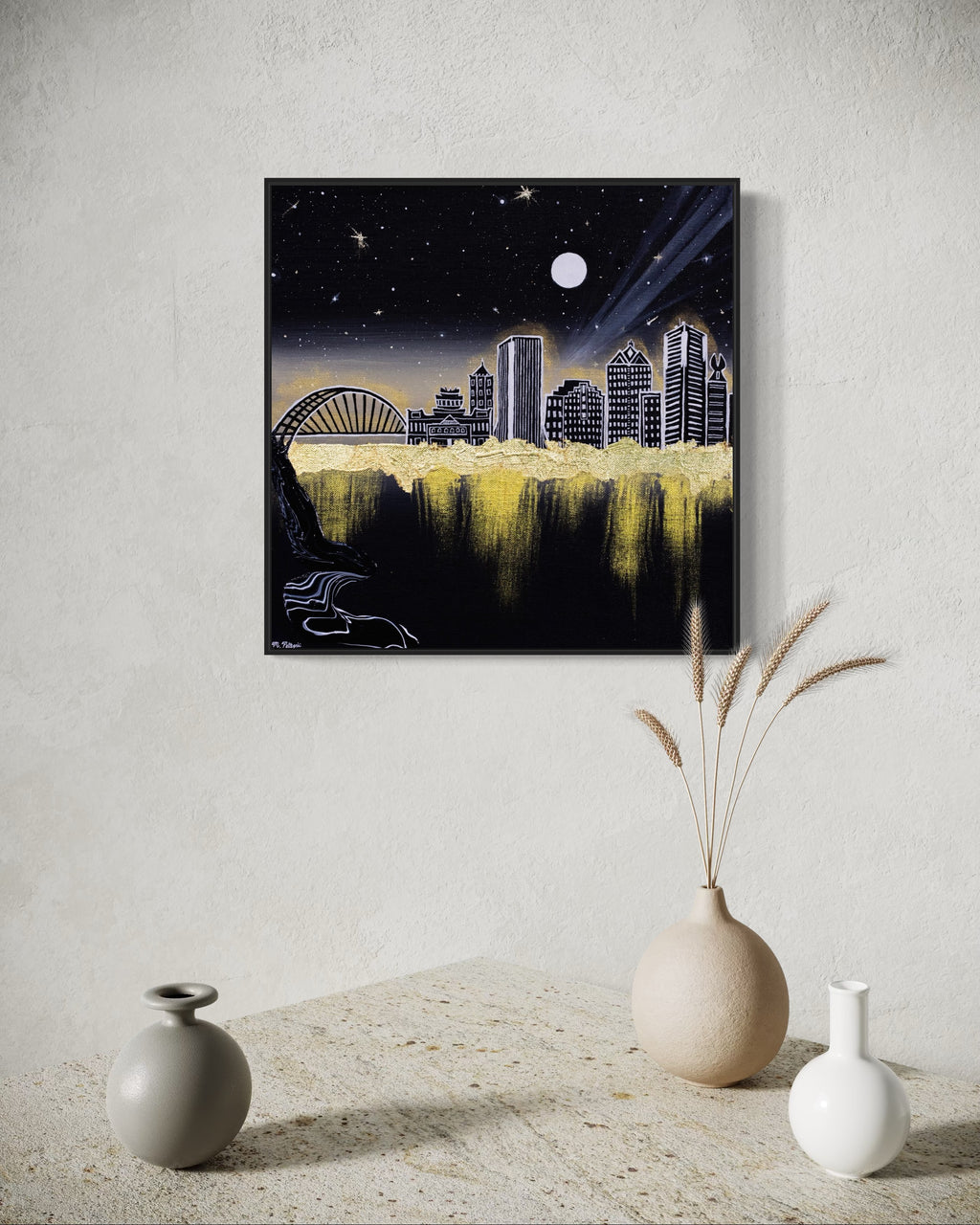 Framed artwork of Rochester, NY city skyline at night with a moonlit sky and glowing gold aura